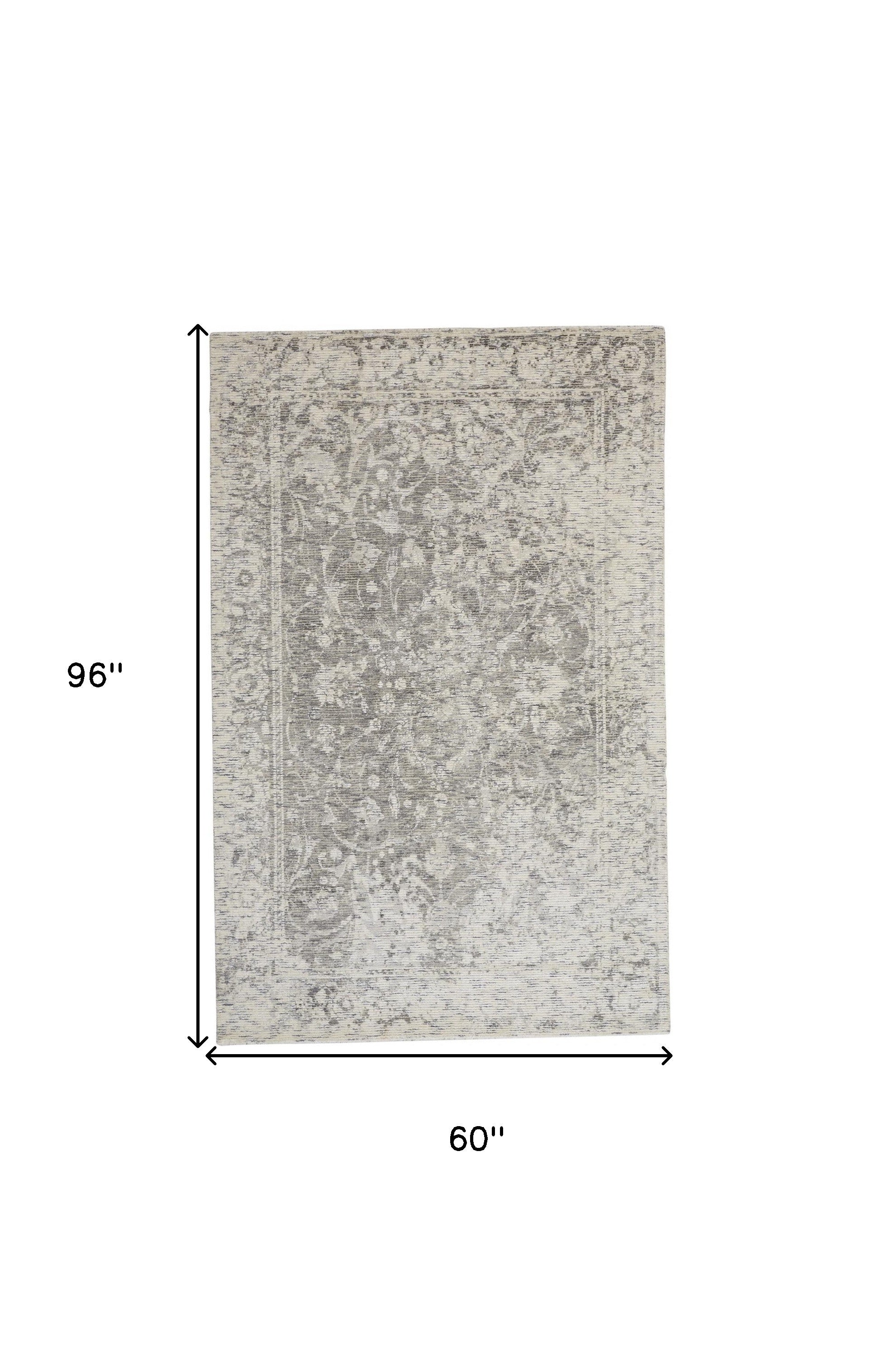 5' X 8' Ivory And Gray Abstract Hand Woven Area Rug