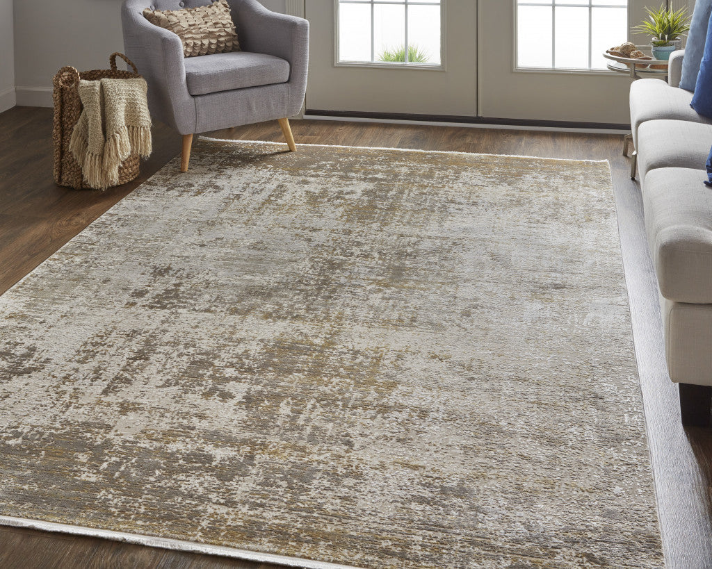 3' X 5' Taupe Ivory And Gold Abstract Power Loom Distressed Area Rug With Fringe