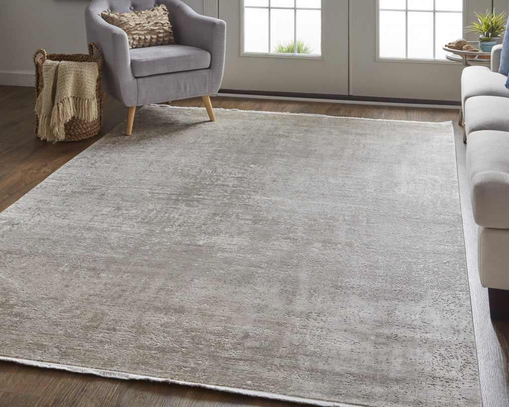 5' X 8' Tan Ivory And Gray Abstract Power Loom Distressed Area Rug With Fringe