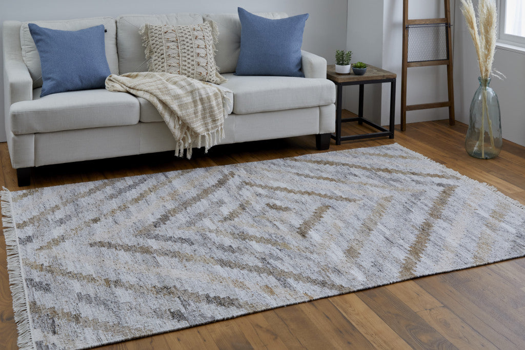 4' X 6' Ivory Gray And Tan Geometric Hand Woven Stain Resistant Area Rug With Fringe