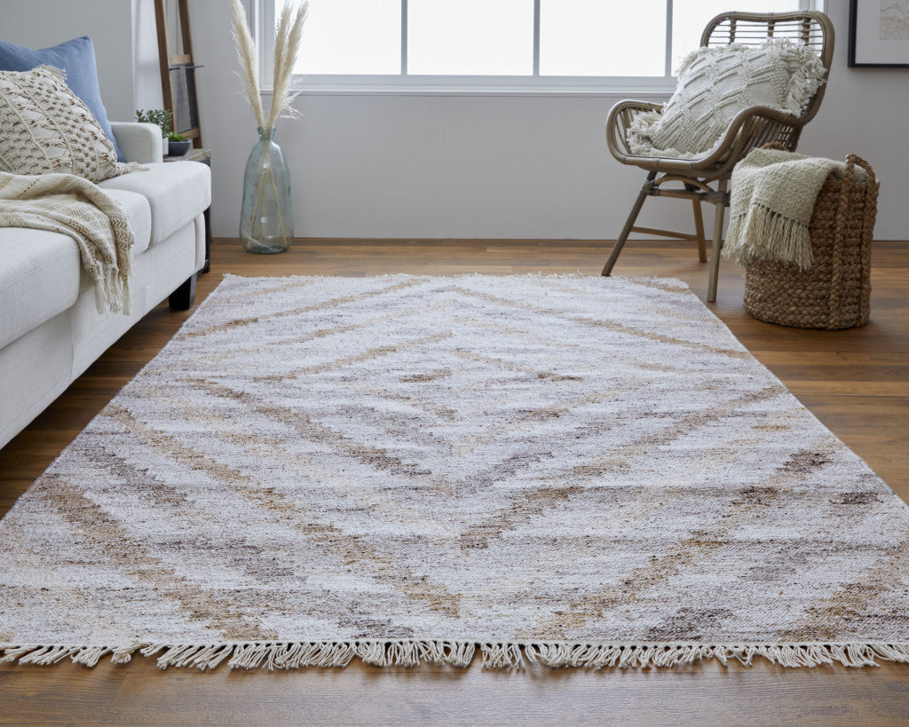 4' X 6' Ivory Gray And Tan Geometric Hand Woven Stain Resistant Area Rug With Fringe