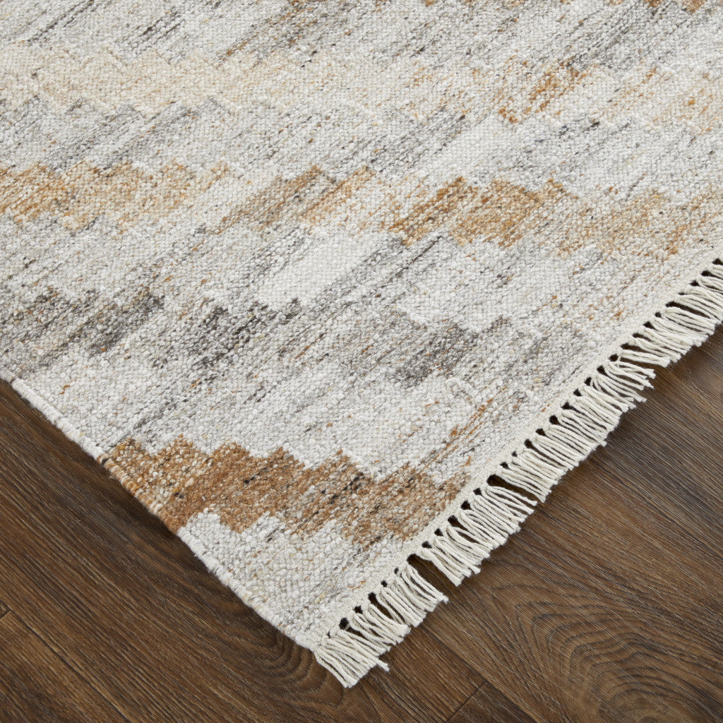 4' X 6' Ivory Gray And Tan Geometric Hand Woven Stain Resistant Area Rug With Fringe