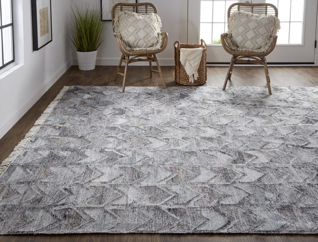 5' X 8' Gray Silver And Taupe Geometric Hand Woven Stain Resistant Area Rug With Fringe