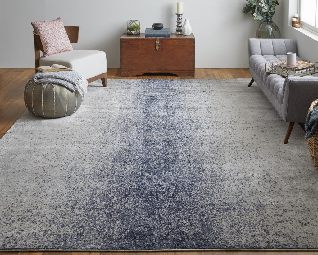 5' X 8' Ivory And Blue Abstract Power Loom Area Rug