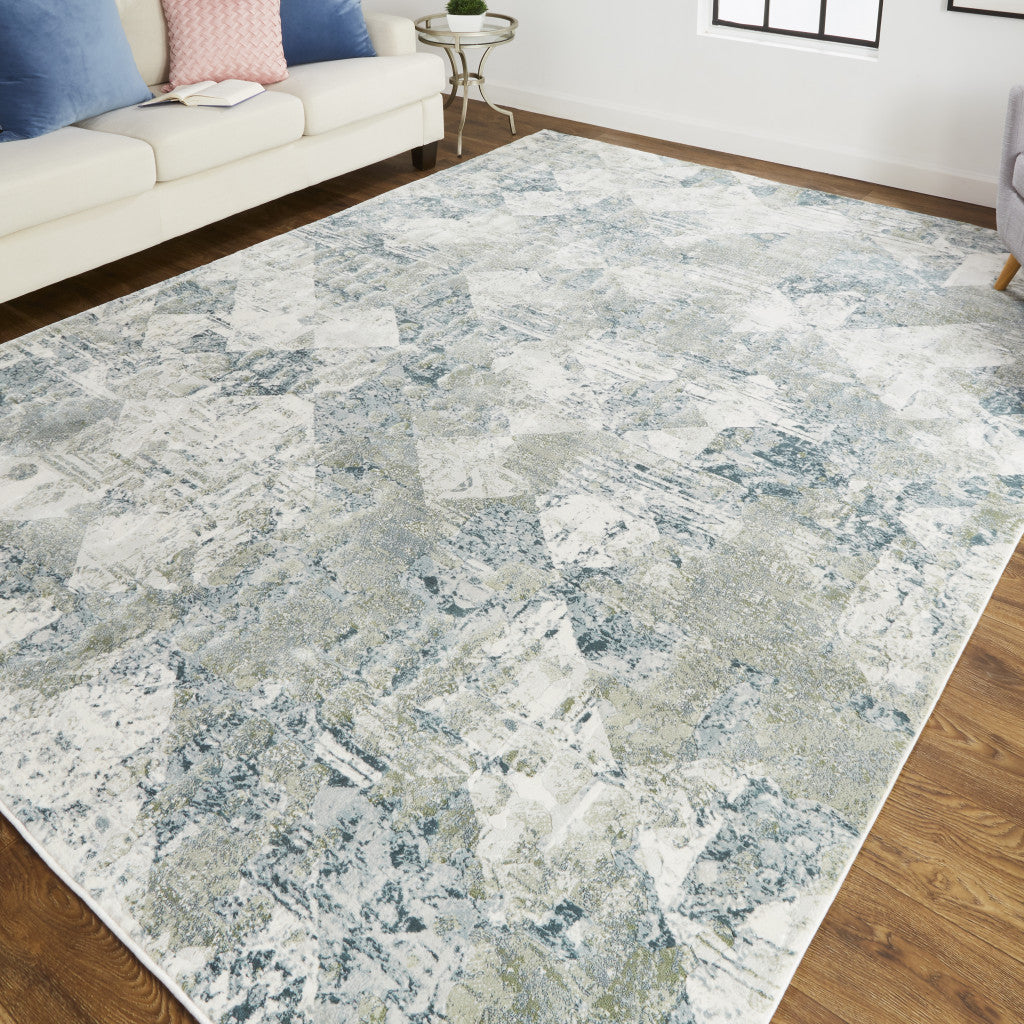 5' X 8' Green And Ivory Patchwork Distressed Stain Resistant Area Rug