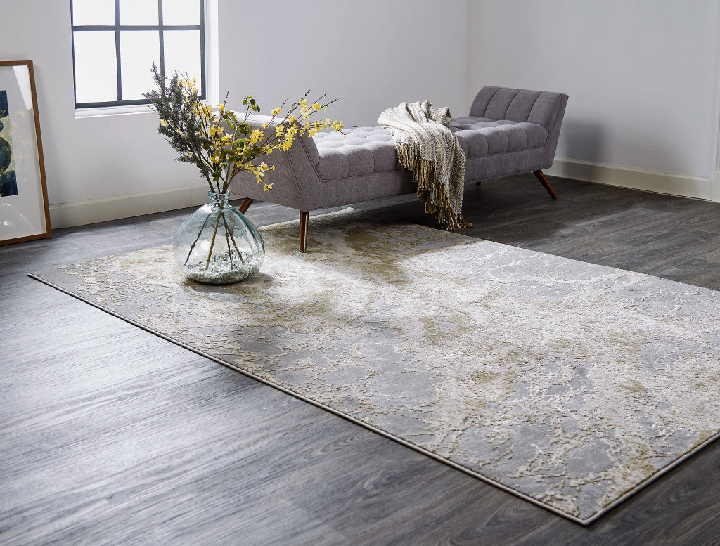 5' X 8' Ivory Silver And Gold Abstract Stain Resistant Area Rug