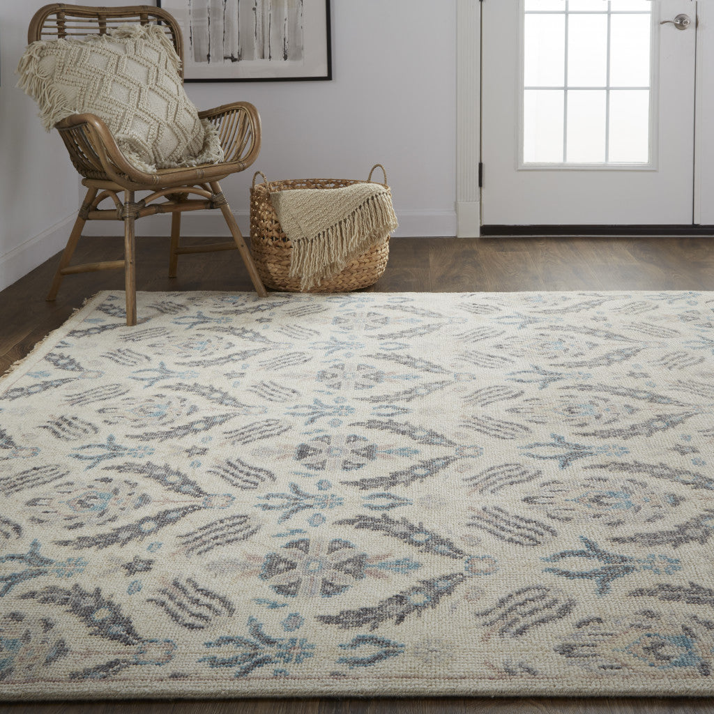 5' X 8' Ivory Gray And Blue Wool Floral Hand Knotted Stain Resistant Area Rug