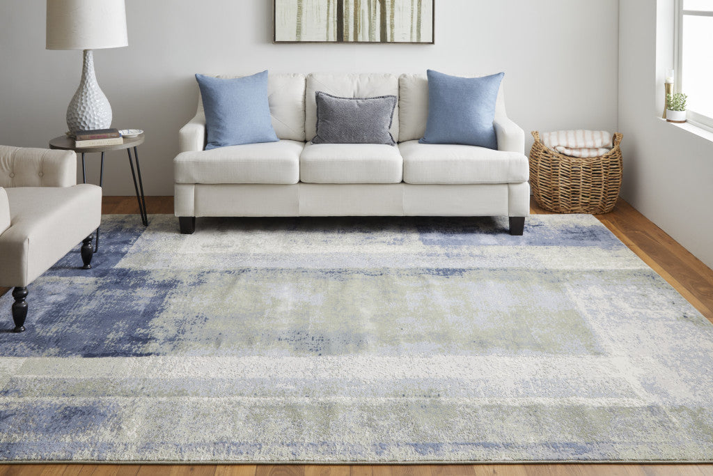 10' X 13' Blue Green And Ivory Abstract Power Loom Distressed Area Rug