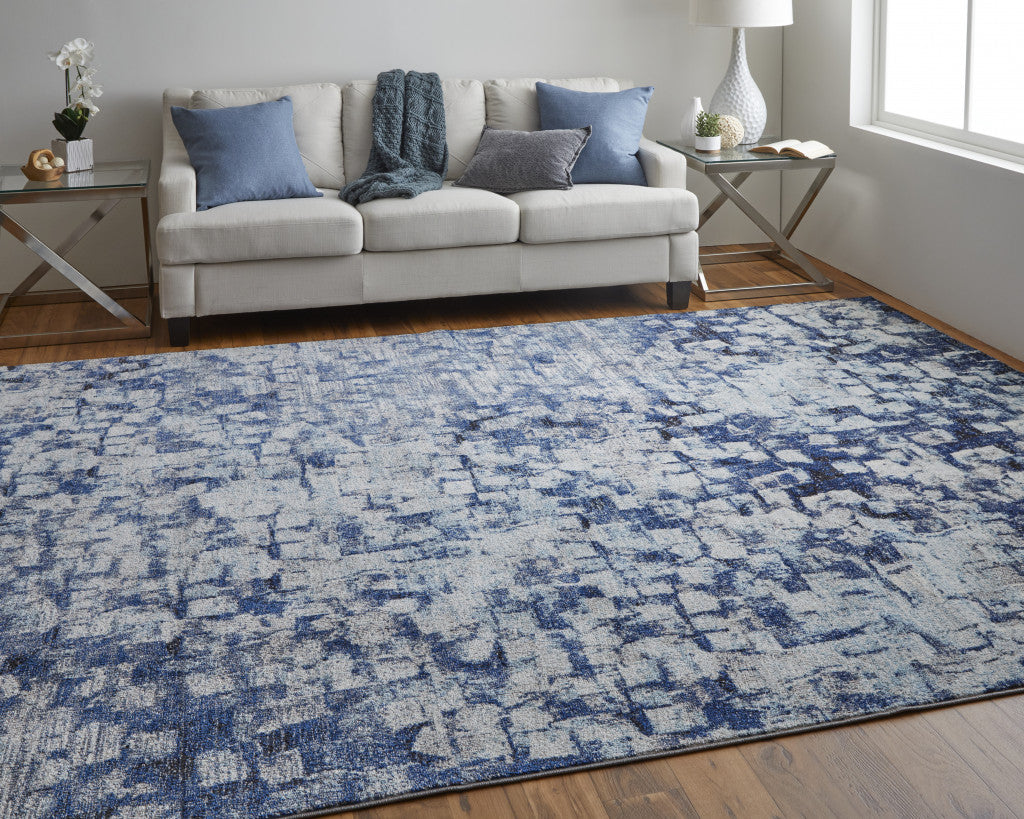 7' X 10' Blue And Ivory Abstract Power Loom Distressed Stain Resistant Area Rug