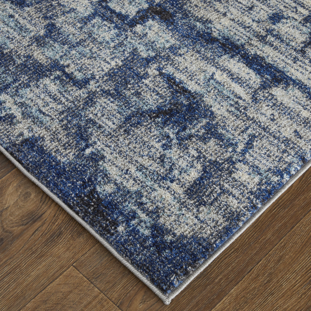 7' X 10' Blue And Ivory Abstract Power Loom Distressed Stain Resistant Area Rug