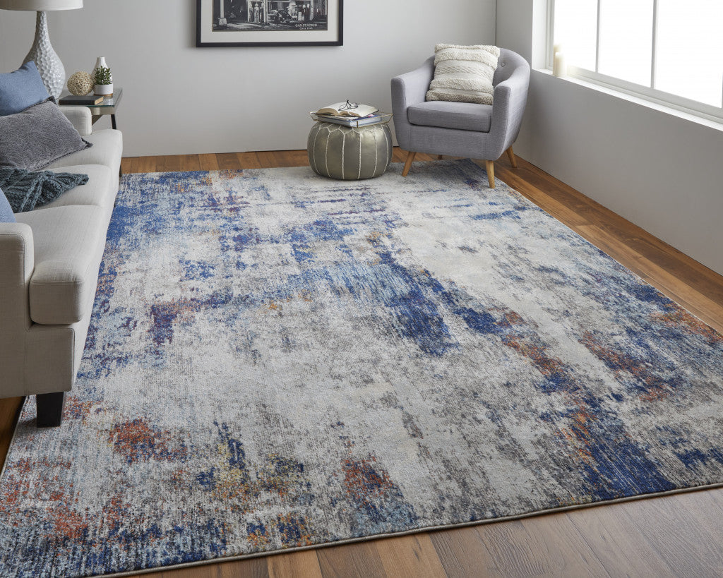 8' X 10' Ivory And Blue Abstract Power Loom Distressed Stain Resistant Area Rug