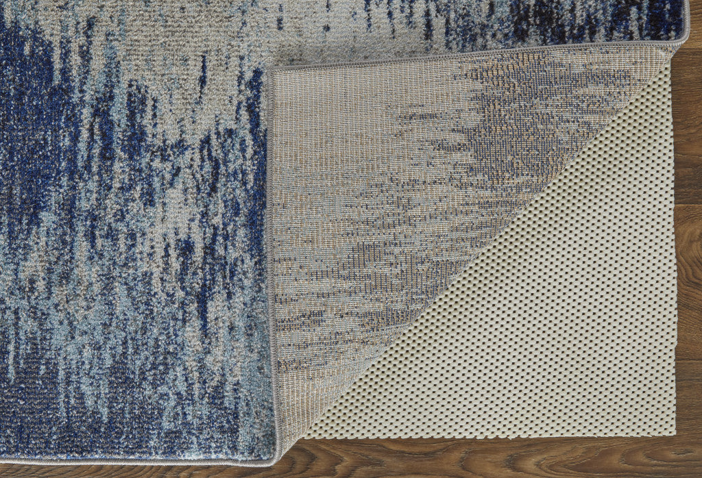 5' X 8' Blue And Ivory Abstract Power Loom Stain Resistant Area Rug