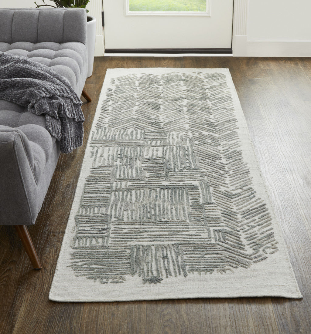 10' Green Blue And Ivory Abstract Hand Woven Runner Rug