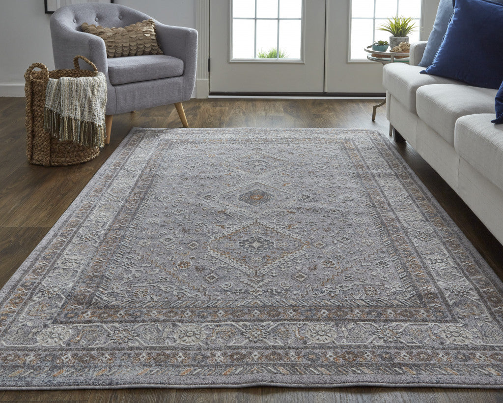 5' X 8' Gray Orange And Ivory Floral Power Loom Stain Resistant Area Rug