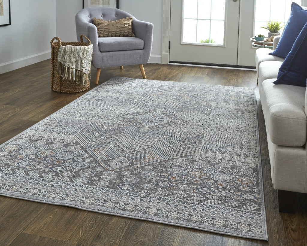 5' X 8' Ivory And Gray Geometric Power Loom Distressed Stain Resistant Area Rug