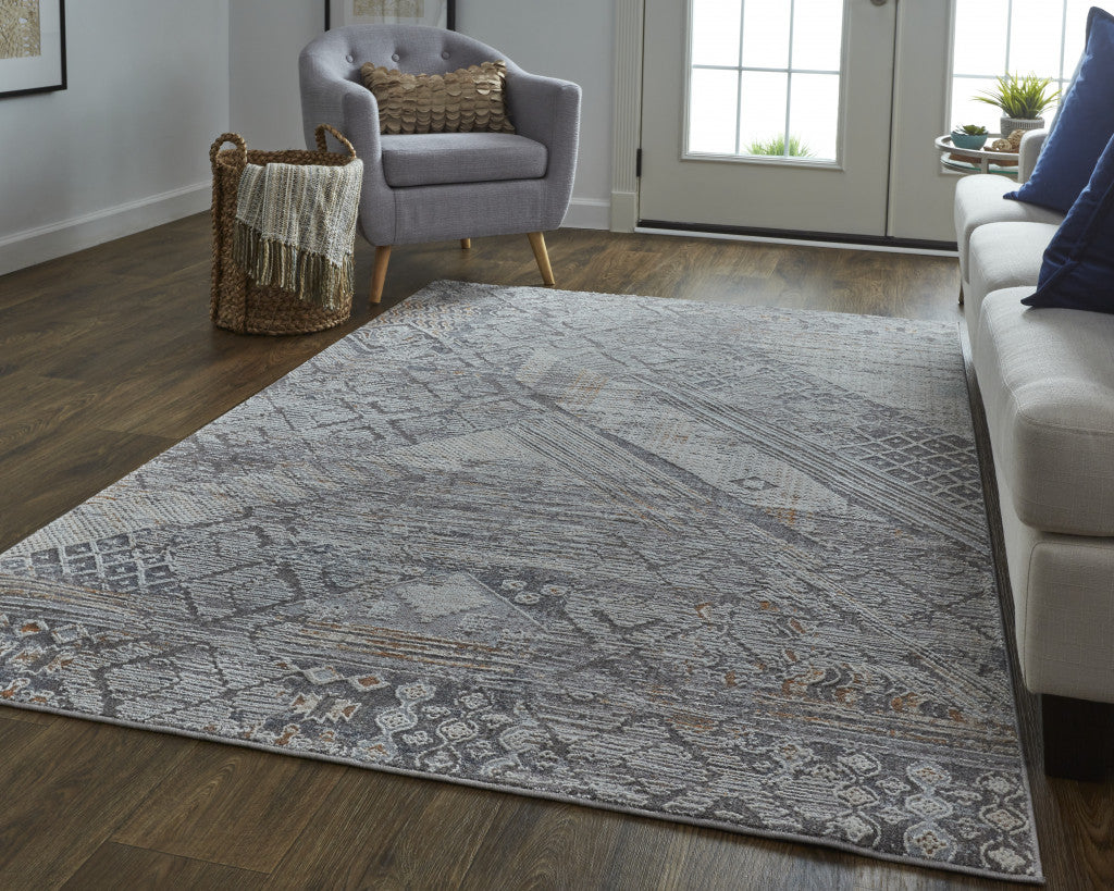 5' X 8' Ivory And Gray Geometric Power Loom Distressed Stain Resistant Area Rug