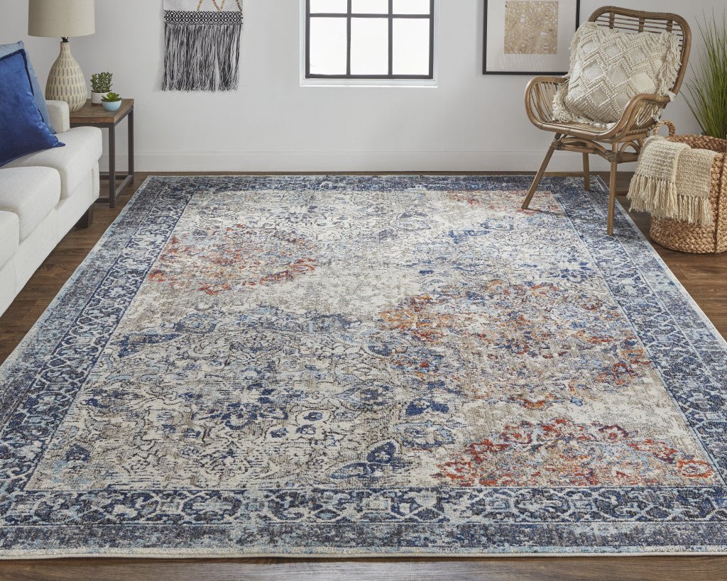 8' X 11' Blue Ivory And Red Floral Power Loom Distressed Stain Resistant Area Rug