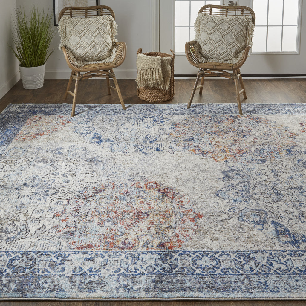 9' X 12' Blue Ivory And Red Floral Power Loom Distressed Stain Resistant Area Rug