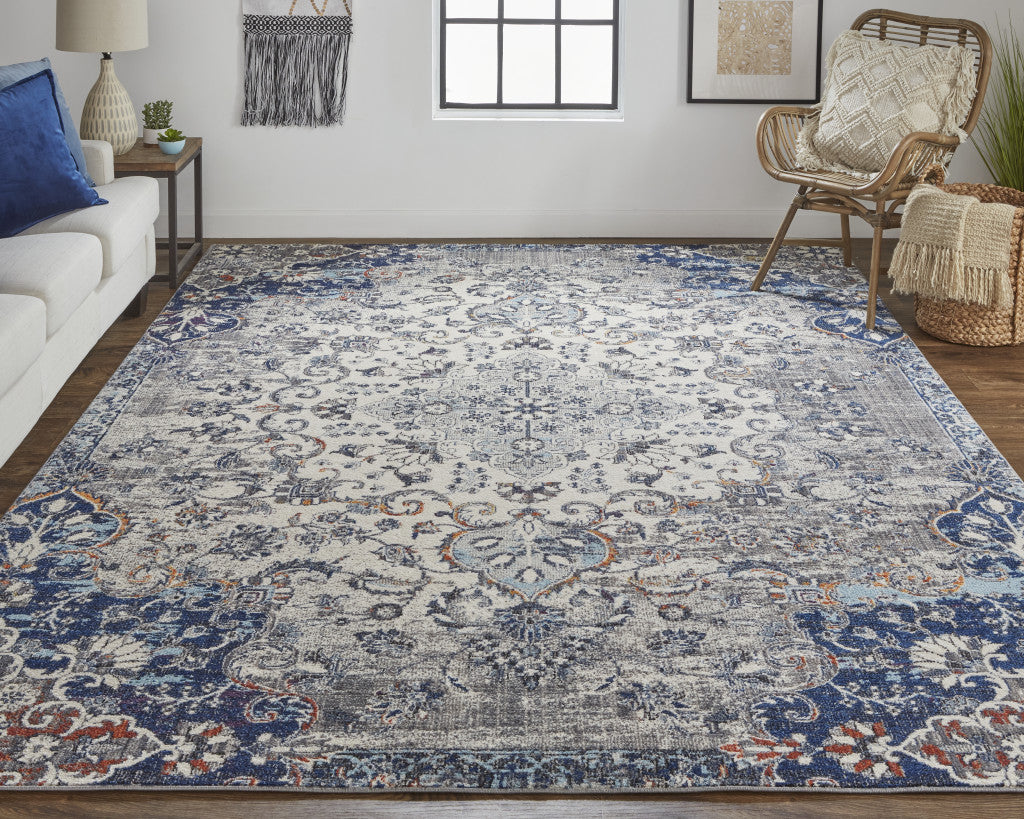 7' X 10' Ivory Gray And Blue Floral Power Loom Distressed Stain Resistant Area Rug