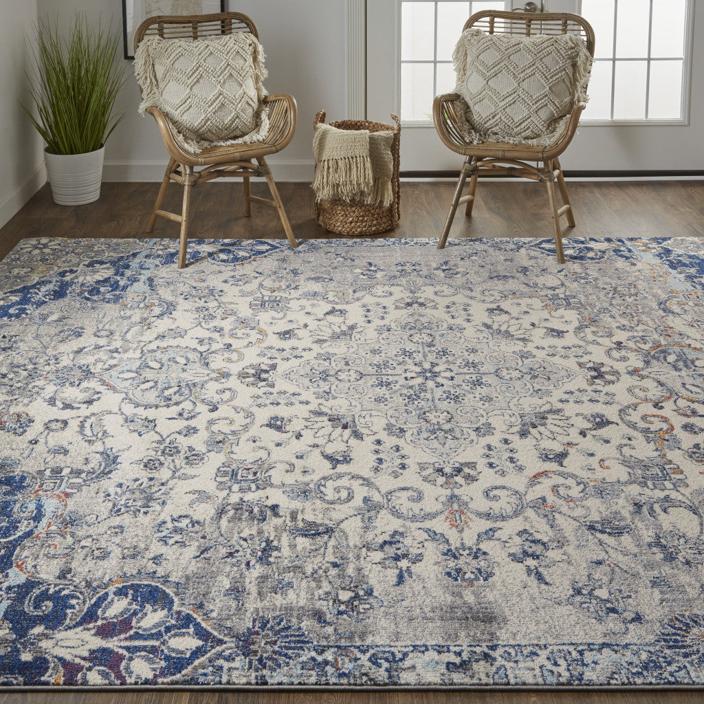 7' X 10' Ivory Gray And Blue Floral Power Loom Distressed Stain Resistant Area Rug