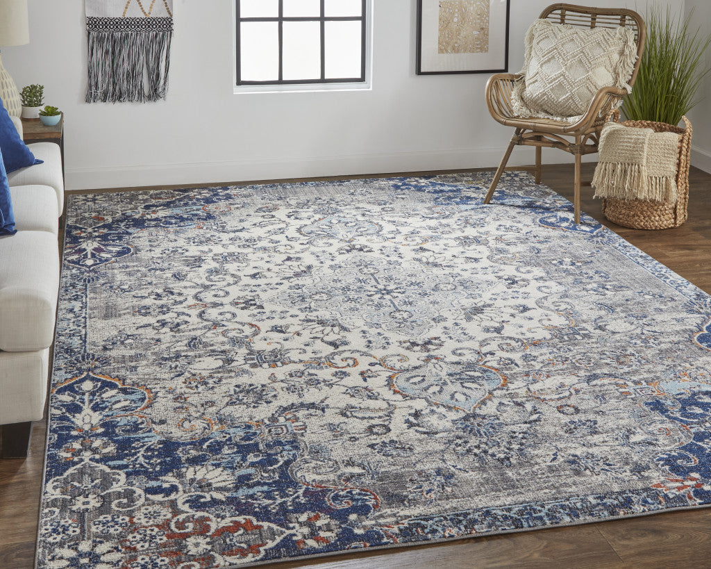 8' X 11' Ivory Gray And Blue Floral Power Loom Distressed Stain Resistant Area Rug