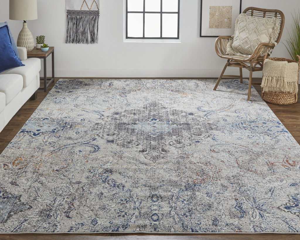 9' X 12' Ivory Taupe And Blue Floral Power Loom Distressed Stain Resistant Area Rug