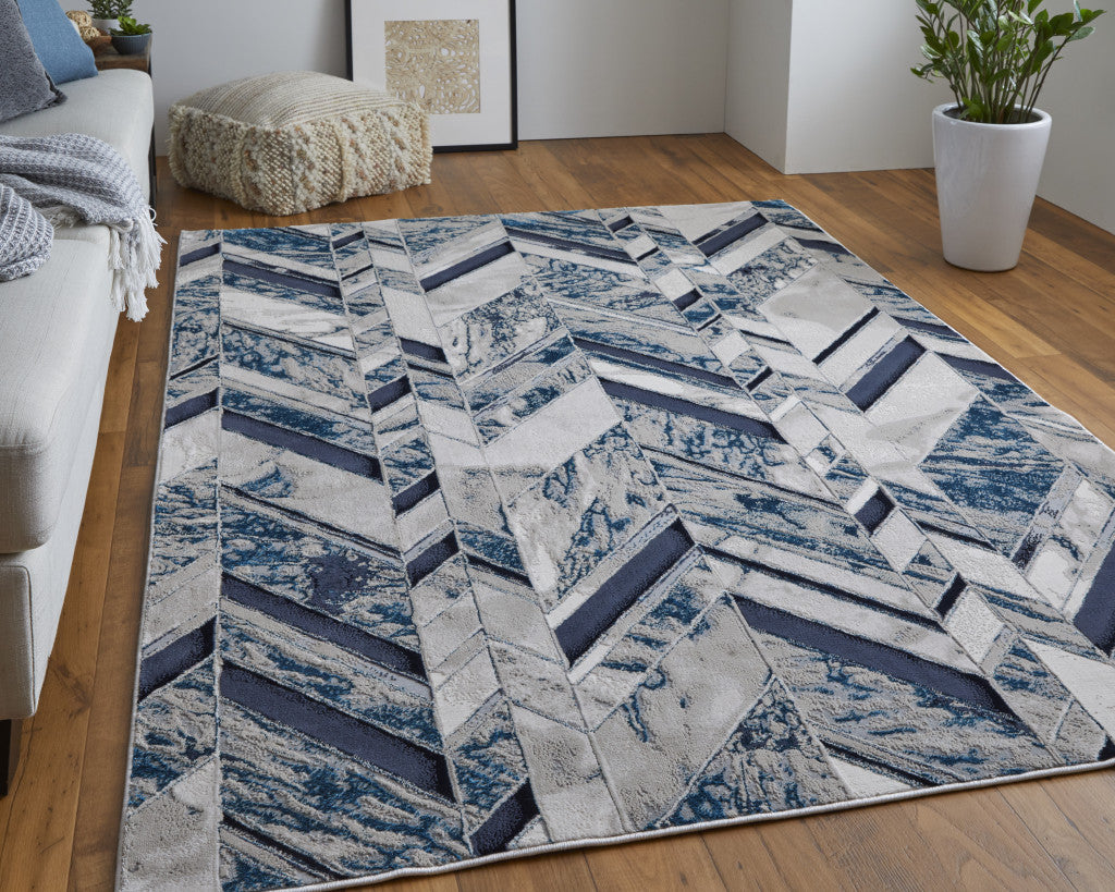 8' X 10' Ivory Blue And Gray Chevron Power Loom Distressed Area Rug