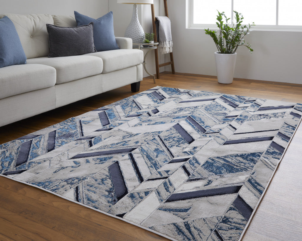 9' X 12' Ivory Blue And Gray Chevron Power Loom Distressed Area Rug