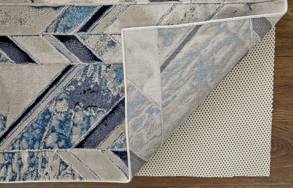 9' X 12' Ivory Blue And Gray Chevron Power Loom Distressed Area Rug