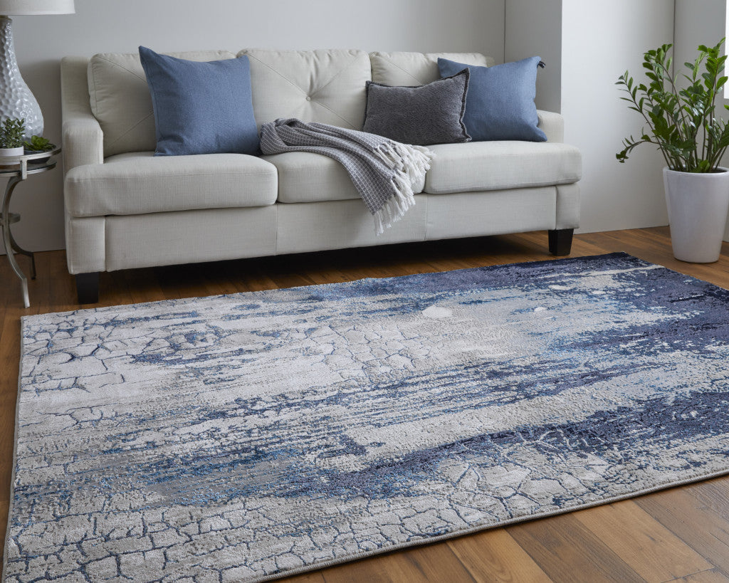 4' X 6' Ivory Blue And Black Abstract Power Loom Distressed Area Rug