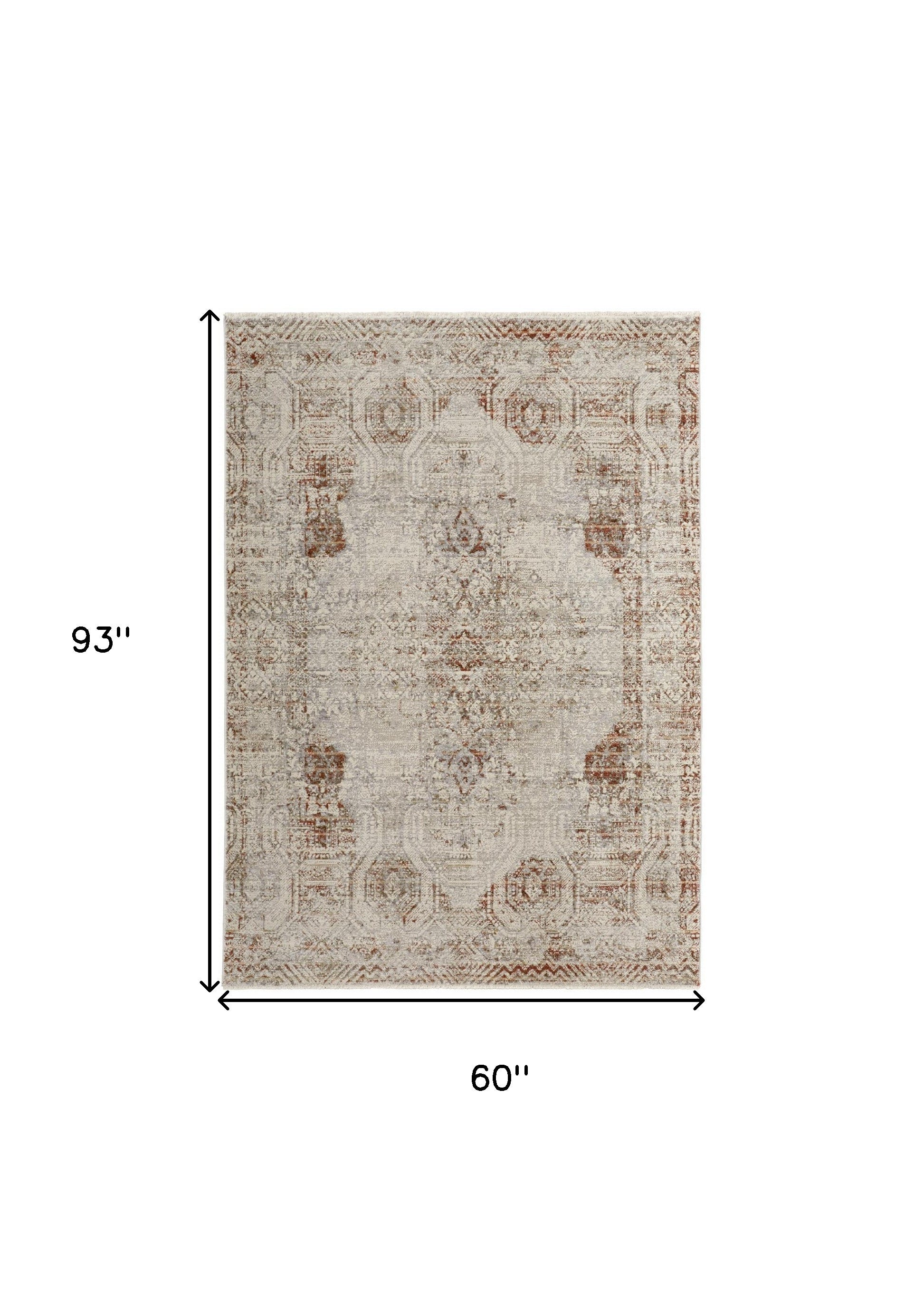 5' X 8' Tan Ivory And Orange Floral Power Loom Distressed Area Rug With Fringe