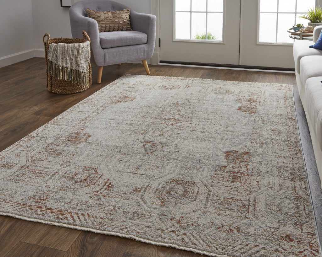 12' X 15' Tan Ivory And Orange Floral Power Loom Distressed Area Rug With Fringe