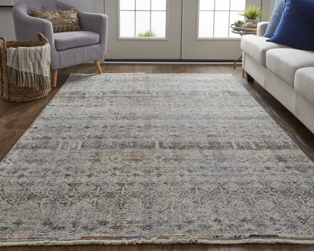 8' X 10' Tan Ivory And Blue Geometric Power Loom Distressed Area Rug With Fringe