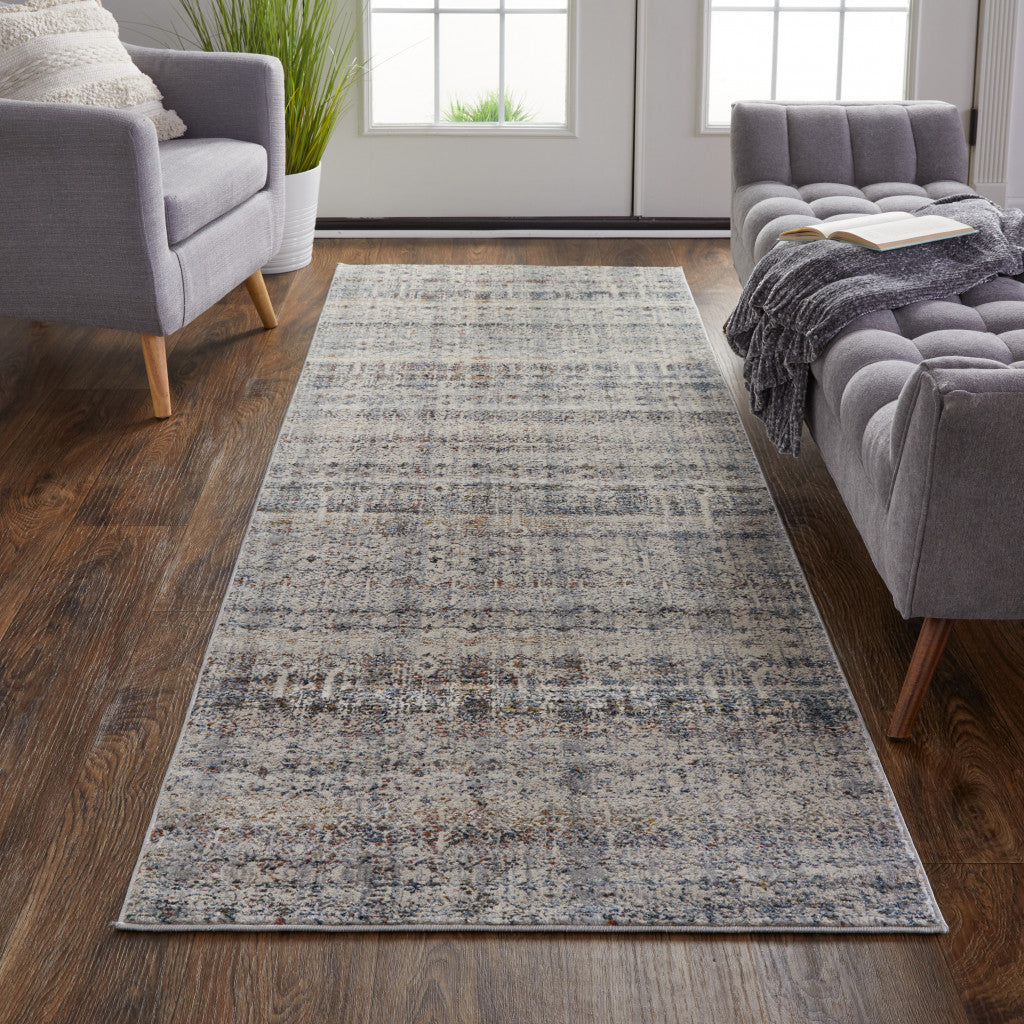 10' Tan Ivory And Blue Geometric Power Loom Distressed Runner Rug With Fringe