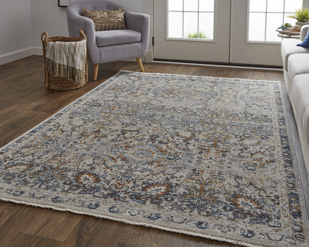 5' X 8' Tan Blue And Orange Floral Power Loom Distressed Area Rug With Fringe