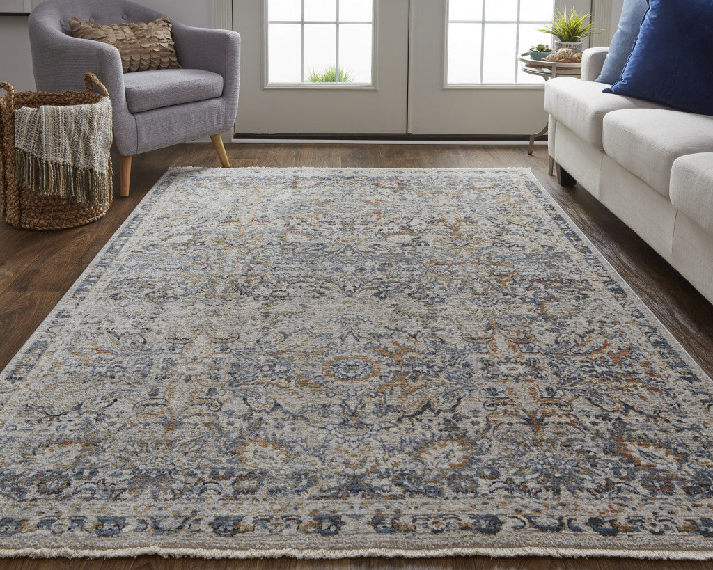 8' X 10' Tan Blue And Orange Floral Power Loom Distressed Area Rug With Fringe