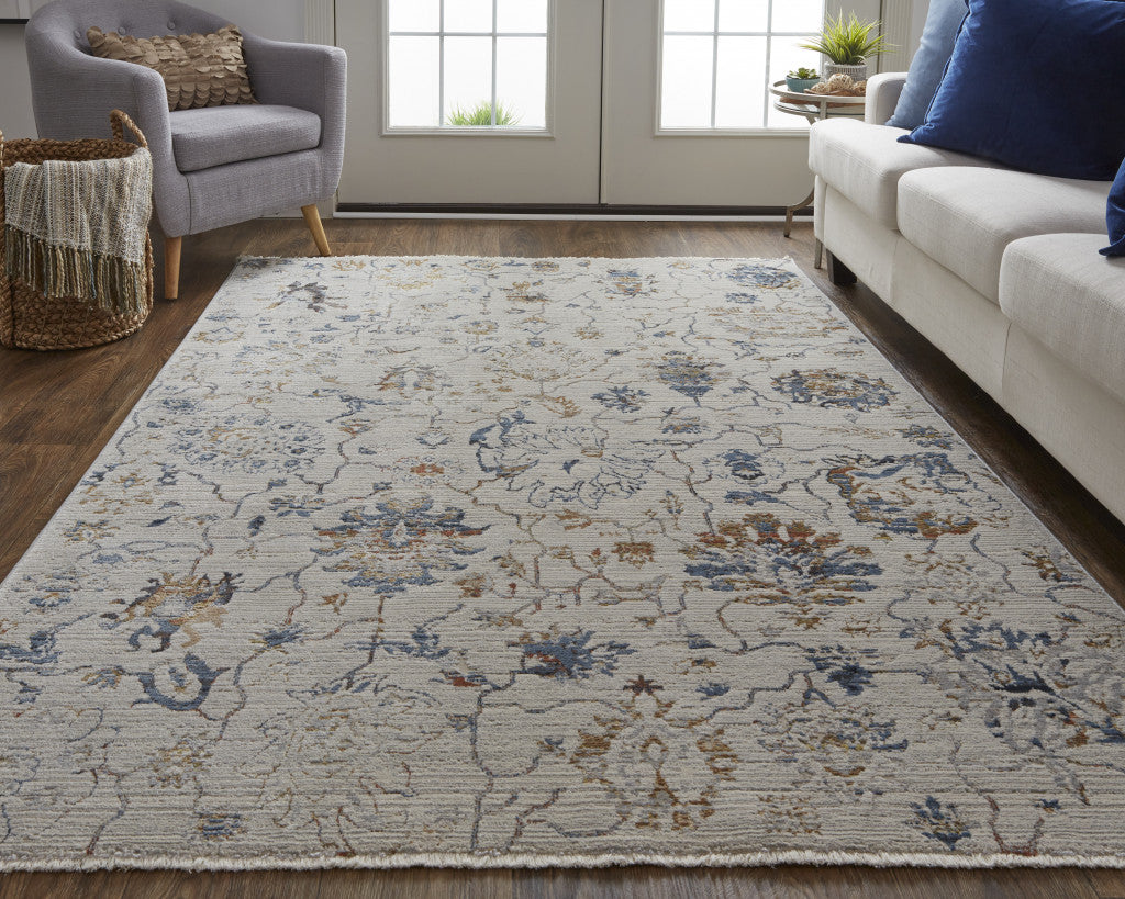 5' X 8' Ivory Orange And Blue Floral Power Loom Distressed Area Rug With Fringe