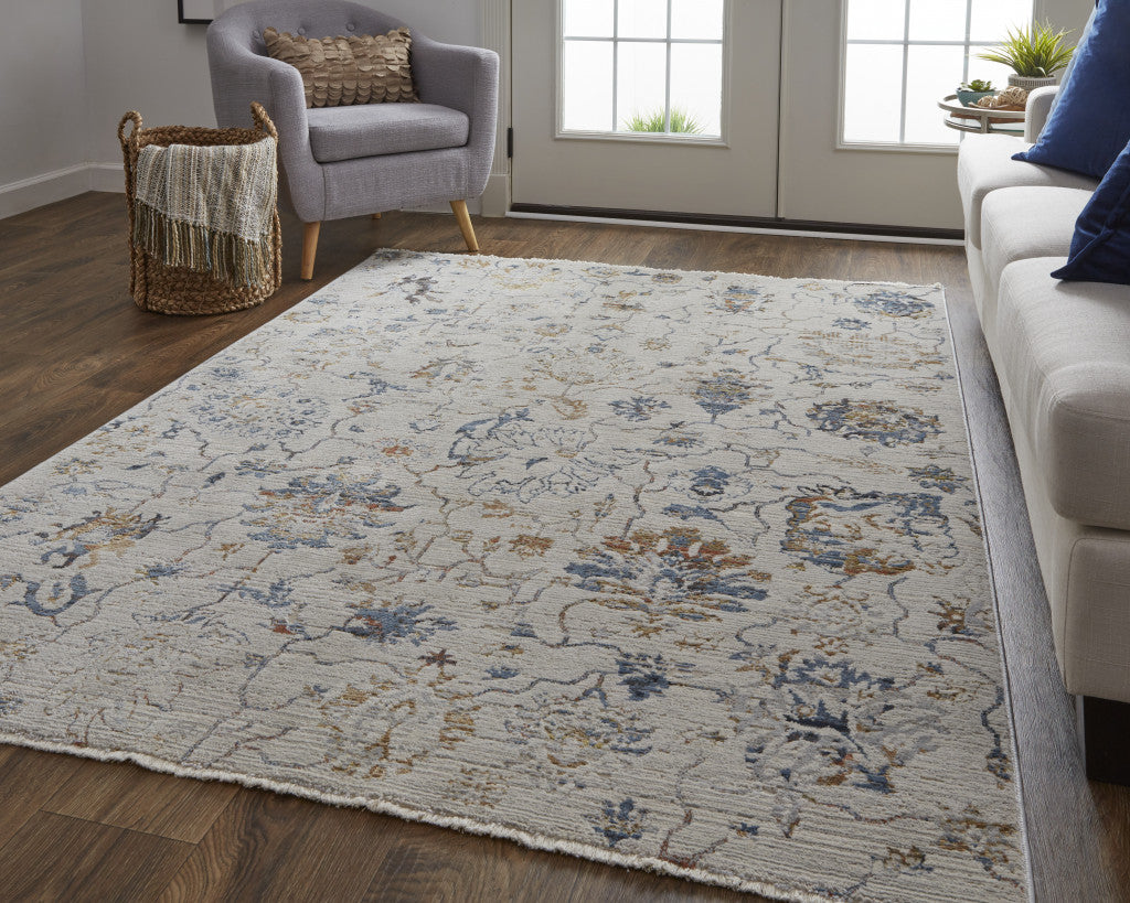 5' X 8' Ivory Orange And Blue Floral Power Loom Distressed Area Rug With Fringe