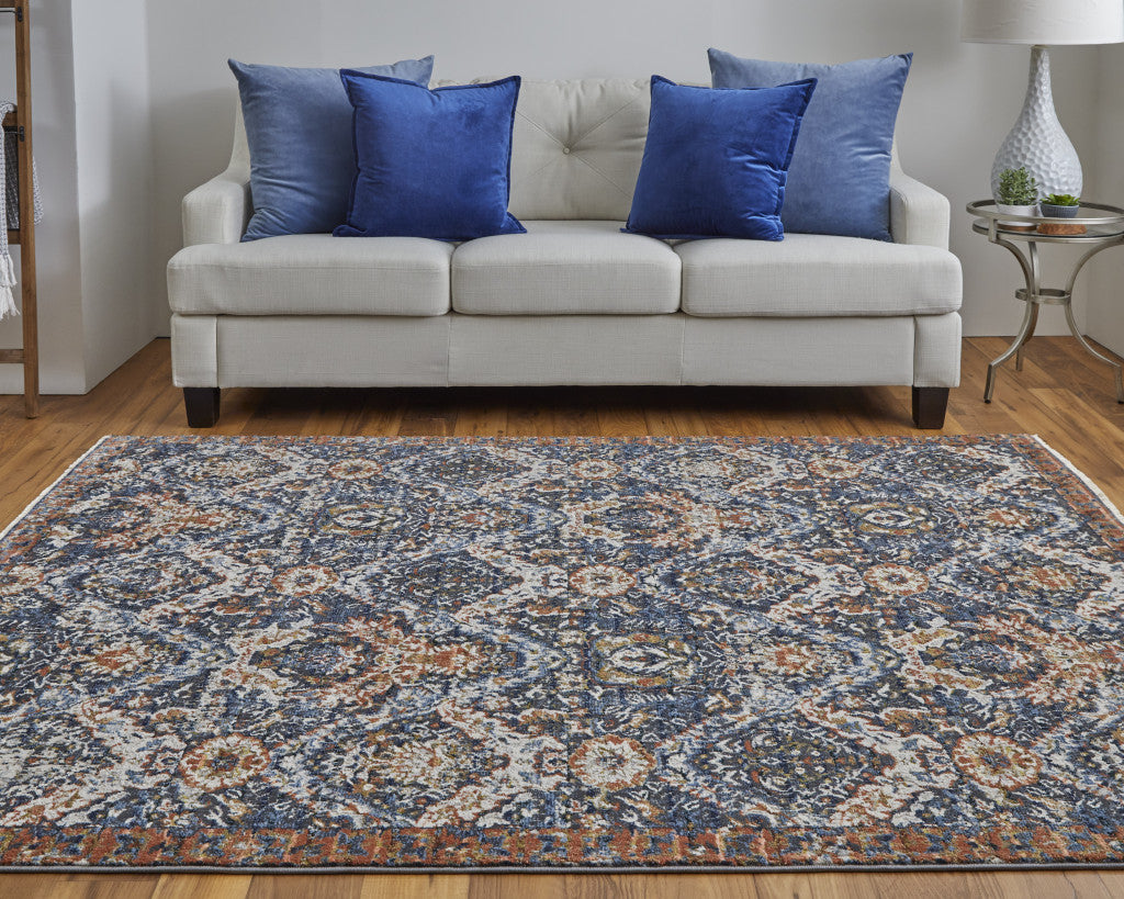 10' X 13' Blue Orange And Ivory Floral Power Loom Area Rug With Fringe