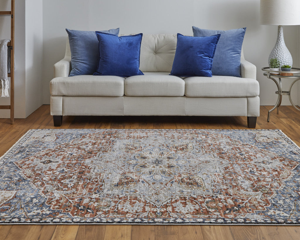 8' X 10' Orange Ivory And Blue Floral Power Loom Area Rug With Fringe