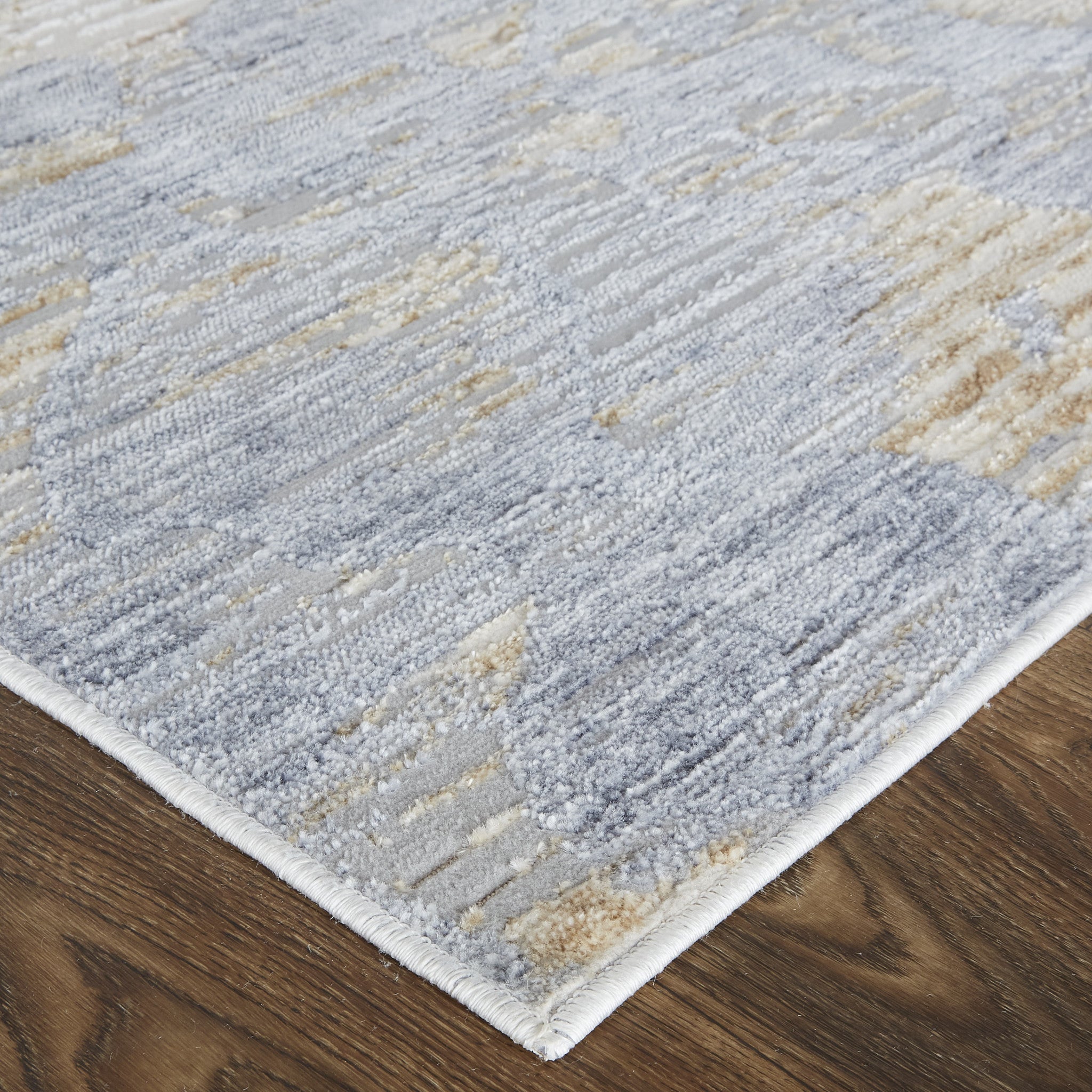 5' X 8' Tan Ivory And Blue Abstract Power Loom Distressed Area Rug