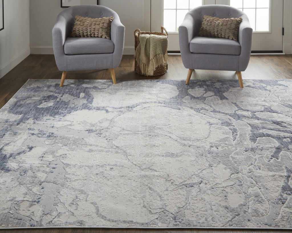 4' X 6' Ivory And Blue Abstract Power Loom Distressed Area Rug