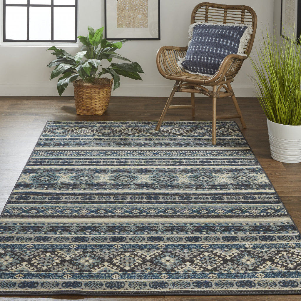 7' X 10' Blue Tan And Black Geometric Power Loom Distressed Stain Resistant Area Rug