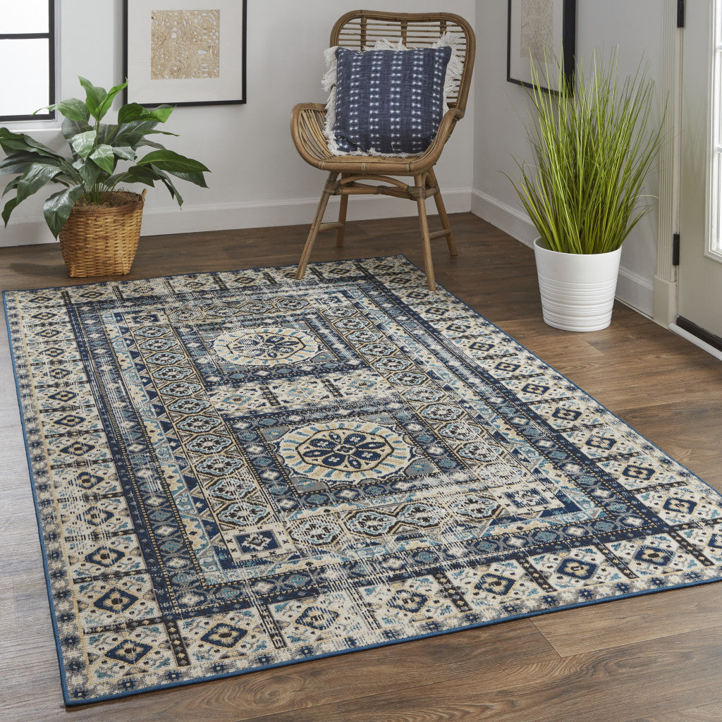 7' X 10' Ivory Tan And Blue Abstract Power Loom Distressed Stain Resistant Area Rug