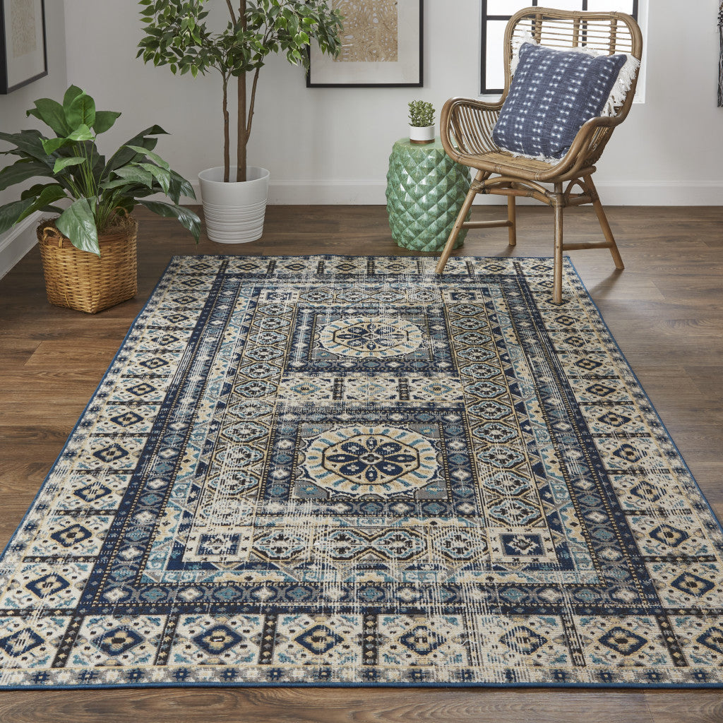 7' X 10' Ivory Tan And Blue Abstract Power Loom Distressed Stain Resistant Area Rug