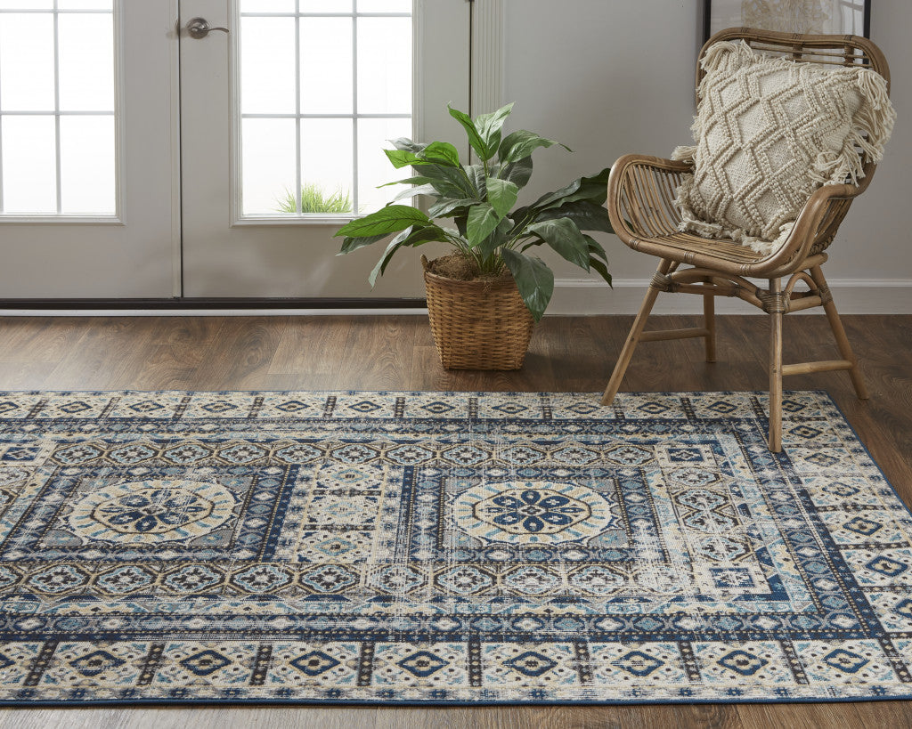 7' X 10' Ivory Tan And Blue Abstract Power Loom Distressed Stain Resistant Area Rug