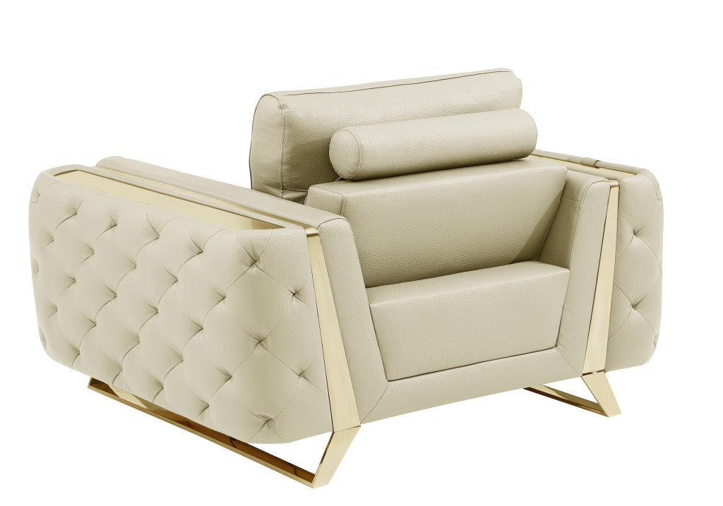 50" Beige and Silver Faux Leather Tufted Arm Chair